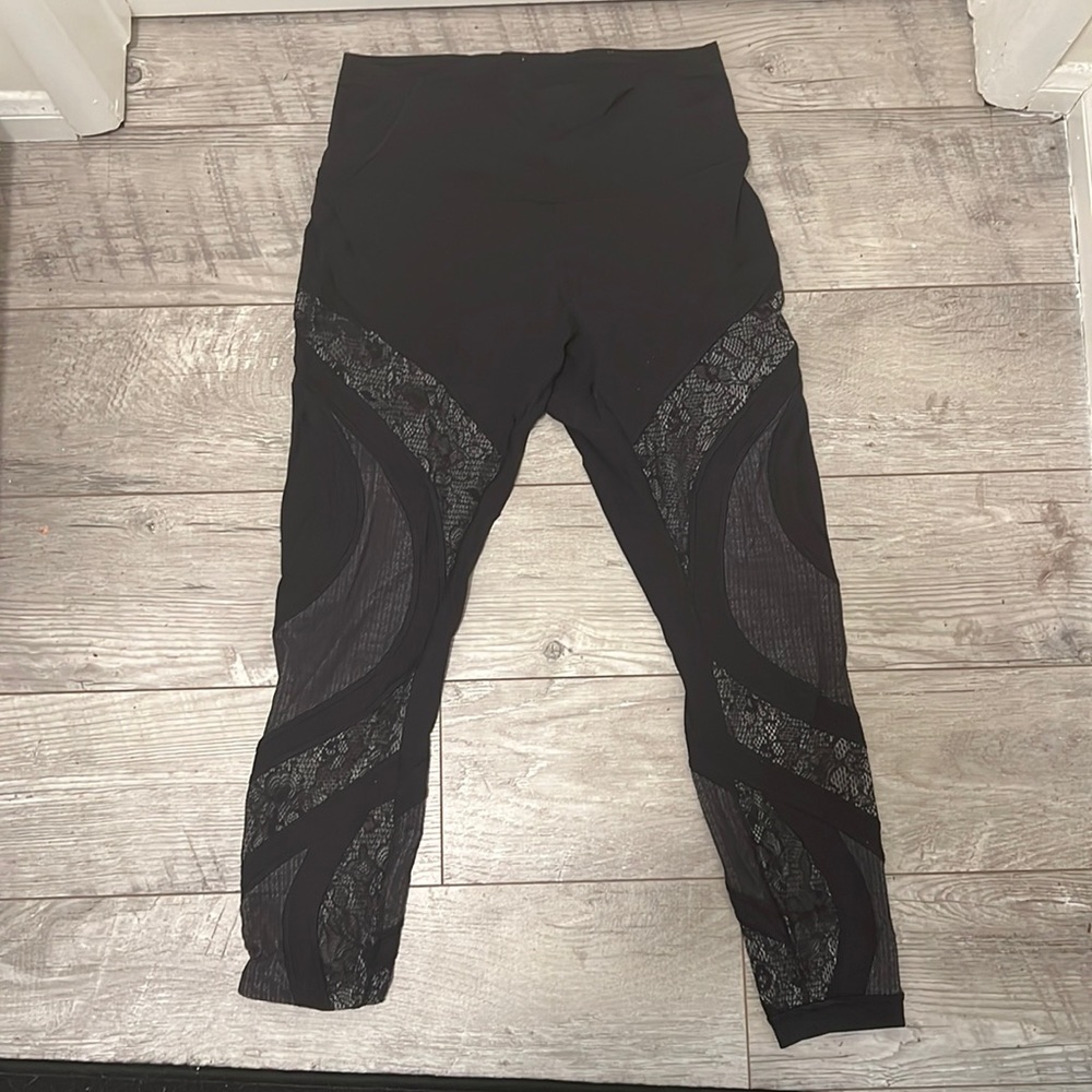 Black Lululemon Athletica leggings with lace accents